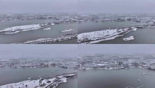 航拍北湖湿地公园雪景湖泊古建筑江南下雪高清在线视频素材下载