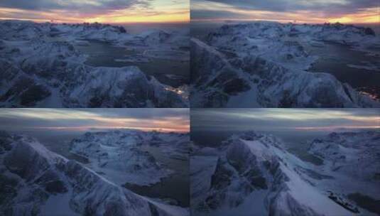 空中探索揭示了北极光下挪威的雪峰高清在线视频素材下载