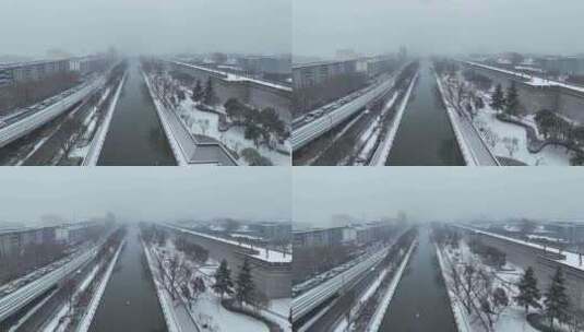 航拍陕西省西安市西安城墙下的护城河雪景高清在线视频素材下载