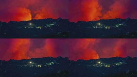 城市灯光附近的野火全景，红色天际线，烟雾高清在线视频素材下载