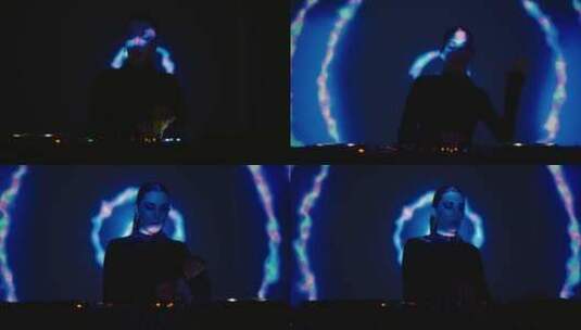 催眠音乐在舞池女人DJ播放曲目和跳舞在黑高清在线视频素材下载
