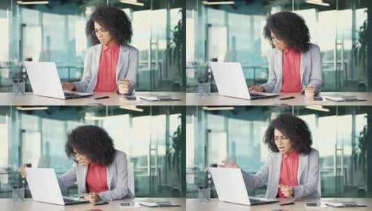 震惊的年轻非裔美国女商人通过在笔记本电脑高清在线视频素材下载