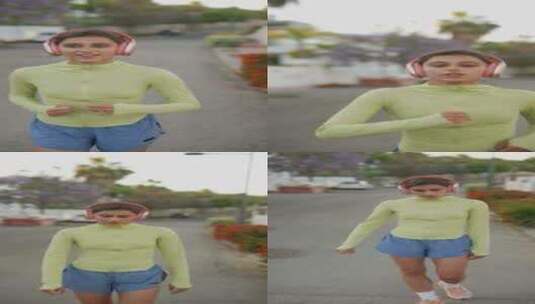 一名妇女在城市环境中戴着耳机跑步，拥抱健高清在线视频素材下载