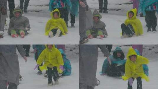 儿童雪地玩耍场景，小女孩打滑摔倒的特写高清在线视频素材下载