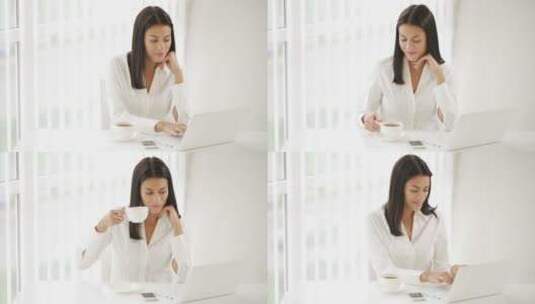女人在办公桌前工作喝茶高清在线视频素材下载