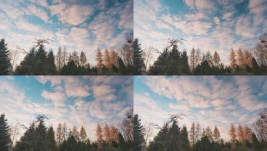 五颜六色的蓬松云在日落的天空中移动高清在线视频素材下载
