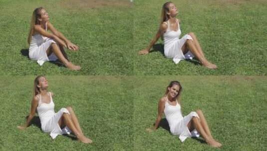 女孩坐在草地上晒太阳高清在线视频素材下载