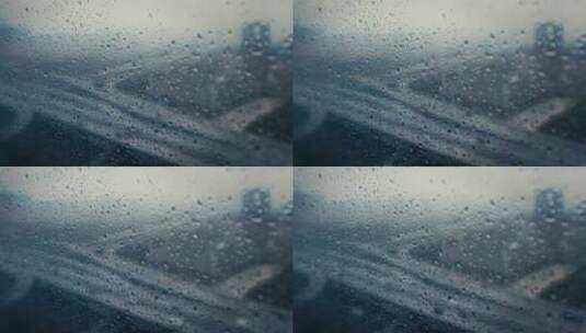 4K下雨天窗户玻璃雨滴车流高清在线视频素材下载