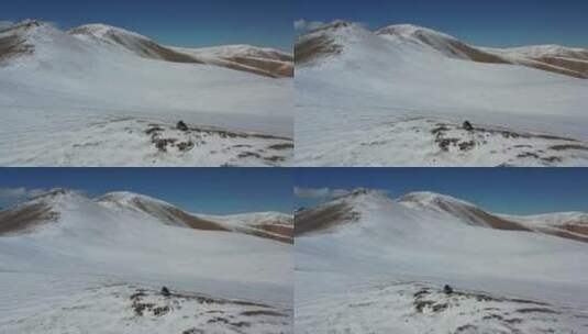 suv汽车越野行驶在一望无际的高山雪原高清在线视频素材下载