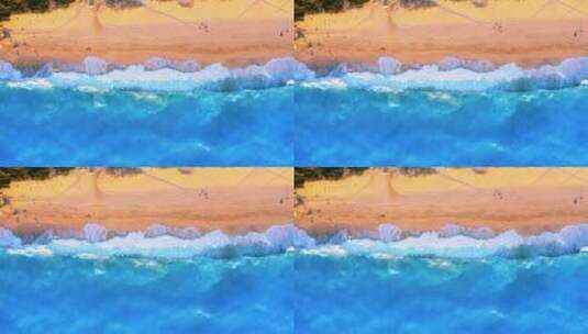 俯拍海浪拍打沙滩高清在线视频素材下载