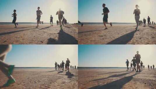 一群在海边沙滩上奔跑慢跑的人高清在线视频素材下载