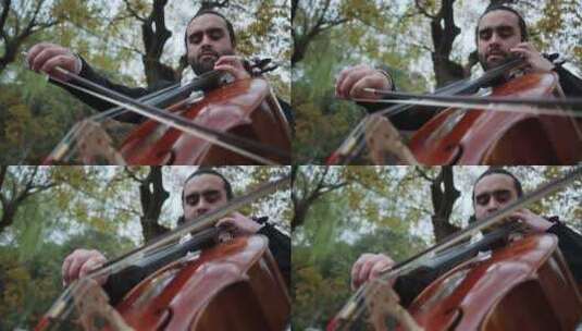 外国男人拉大提琴在户外高清在线视频素材下载