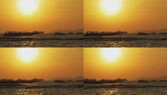 海上的红色日落与剪影船在波浪上摇摆泰国芭高清在线视频素材下载