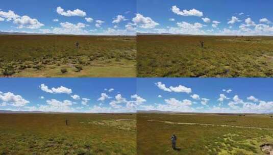 航拍内蒙古大草原蓝天白云人物行走高清在线视频素材下载