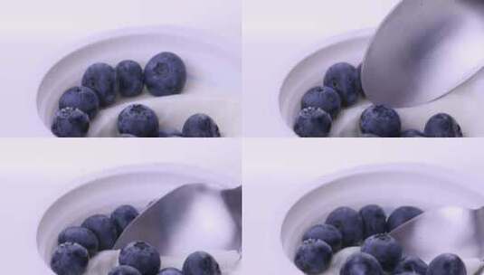 白背景酸奶特写舀蓝莓固定高清在线视频素材下载
