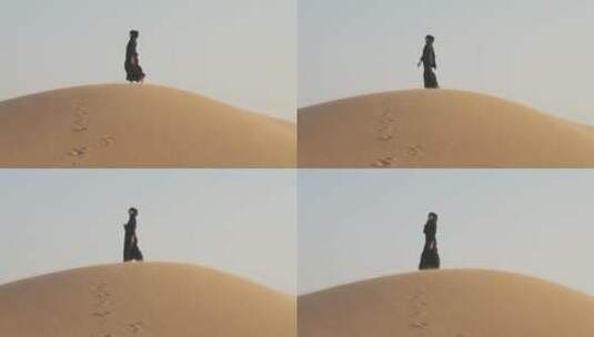 穆斯林在沙漠上行走 高清在线视频素材下载