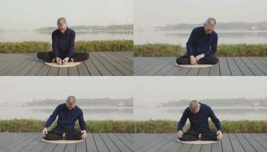 深圳人才公园打坐冥想的男人高清在线视频素材下载