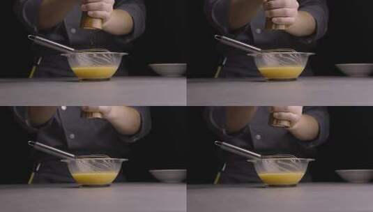 4K厨师往鸡蛋液撒黑胡椒特写高清在线视频素材下载