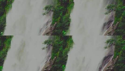 云南千家寨大吊水瀑布从山间落下 升格高清在线视频素材下载