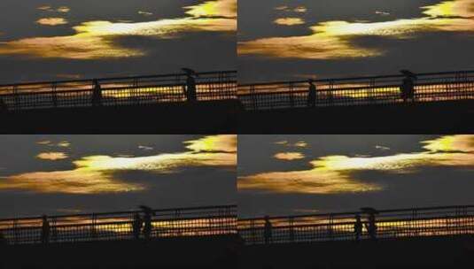 日余晖下天桥上的行人升格镜头高清在线视频素材下载