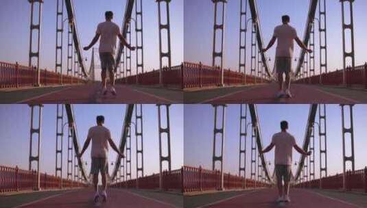 男运动员在桥上跳跃高清在线视频素材下载