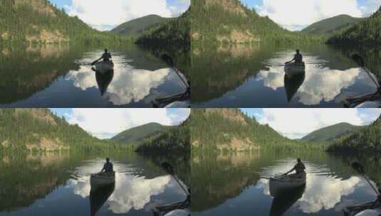 男人划着独木舟行驶在湖上高清在线视频素材下载