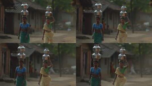 印度妇女顶着铁桶行走高清在线视频素材下载