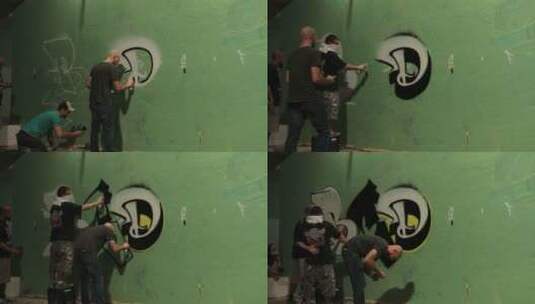 涂鸦者在墙上喷涂涂鸦的延时镜头高清在线视频素材下载