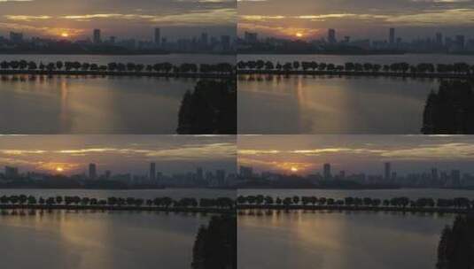 航拍武汉东湖绿道傍晚湖面夕阳高清在线视频素材下载