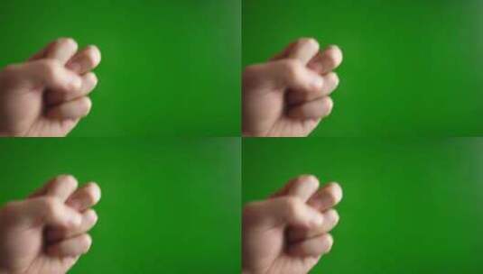 02.一个男人用手（张开）敲绿色背景高清在线视频素材下载