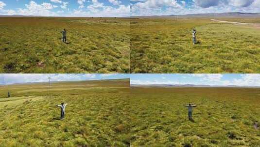 航拍内蒙古大草原草地蓝天白云人物空景高清在线视频素材下载