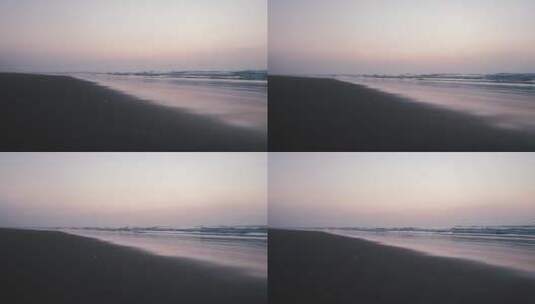 日落时海浪冲向海岸高清在线视频素材下载