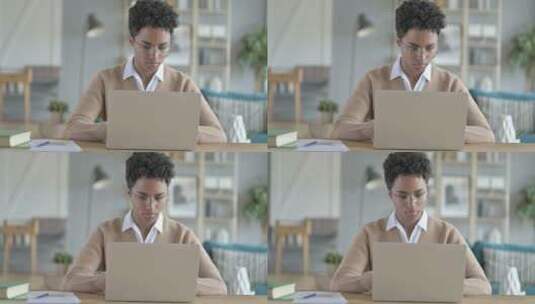 年轻非洲女孩在笔记本电脑上工作高清在线视频素材下载