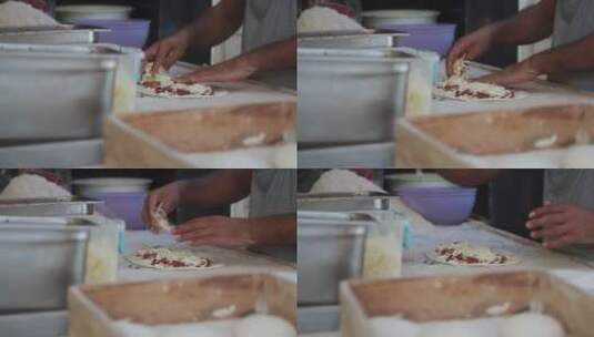 面包店厨师把奶酪放在面饼上高清在线视频素材下载