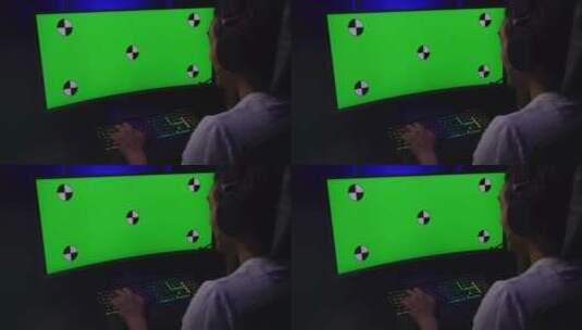 游戏玩家坐在电脑前玩游戏高清在线视频素材下载