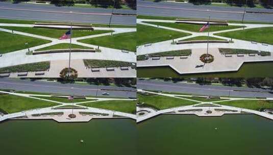 美国国旗在社区湖上的空中拉回高清在线视频素材下载