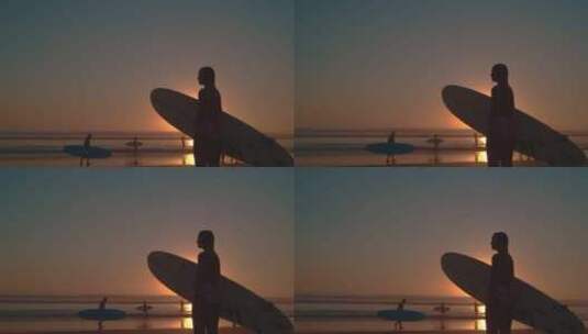 海边夕阳下女孩拿着冲浪板等朋友高清在线视频素材下载