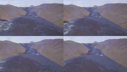 白天，冰岛格尔丁加达利尔火山熔岩场升起的蒸汽。空中高清在线视频素材下载