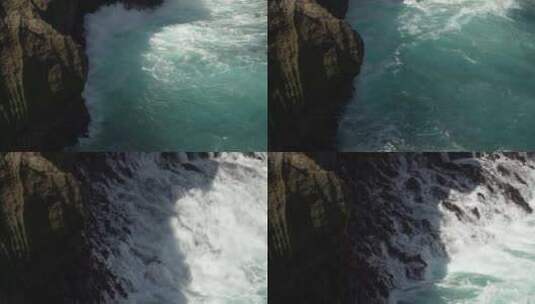 鸟瞰海浪拍打岩石高清在线视频素材下载