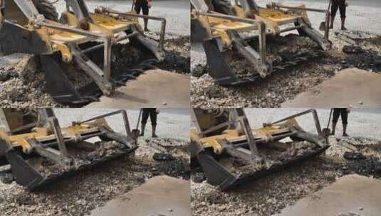挖掘机铲斗破坏沥青路面高清在线视频素材下载