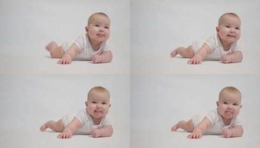 白色背景上心满意足的婴儿肖像，成为人类的概念阶段高清在线视频素材下载