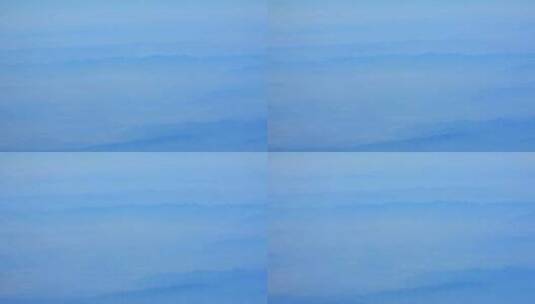 飞机窗外云雾缭绕重峦叠嶂的山峦高清在线视频素材下载