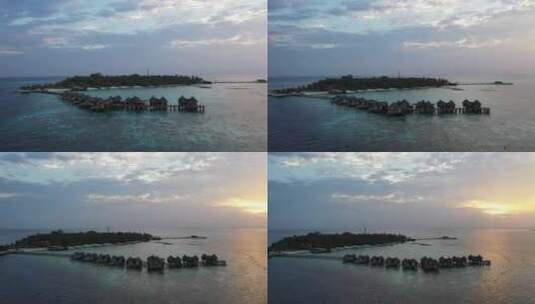 马尔代夫岛屿度假胜地的无人机照片。日落时高清在线视频素材下载