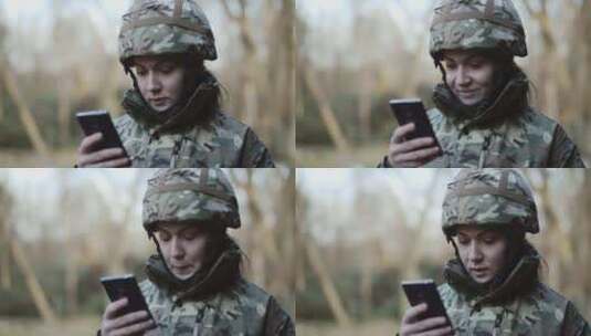 女兵看着她的手机高清在线视频素材下载