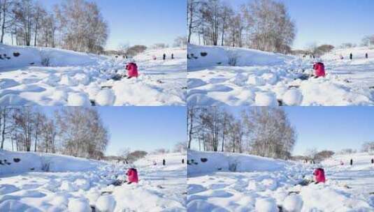内蒙景区冰天雪地上玩耍的人高清在线视频素材下载