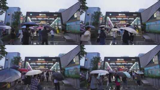杭州滨江区聚才路地铁站下雨天地铁进站人流高清在线视频素材下载