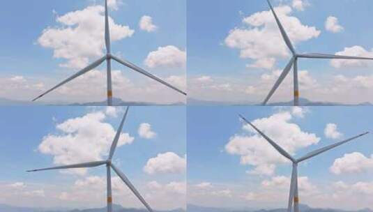 航拍蓝天白云下的风力发电机高清在线视频素材下载