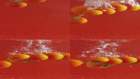 2K竖屏红色背景的小番茄落水高清在线视频素材下载