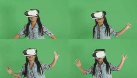 绿幕背景前戴着VR眼镜的女孩高清在线视频素材下载
