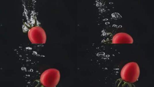 新鲜小番茄落入水中的特写慢镜头高清在线视频素材下载